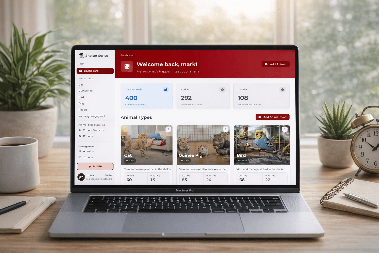 Laptop with Shelter Sense dashboard showing the enrichment tracking interface